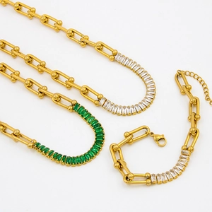 Golden stainless steel U-link necklace and bracelet set with green zircon stones