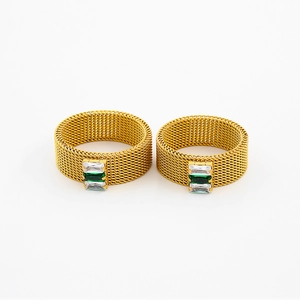 Detail of vintage mesh titanium steel ring with emerald and zircon gemstone setting
