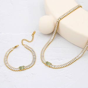 Detail of 18K gold-plated tennis jewelry set featuring colorful zircon stones and K18 hallmark
