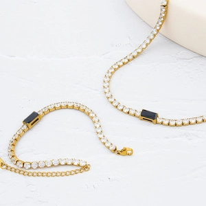 Gold plated tennis chain set with white zircon stones and black rectangular center gem