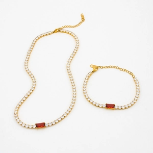 Gold tennis jewelry set with red rectangle gemstone necklace and matching bracelet