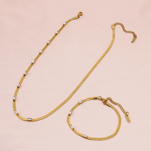 Golden stainless steel snake chain jewelry set with rectangular zircon crystals