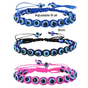 Detail of 6mm Evil Eye woven bracelets in blue, black, and pink with adjustable cord