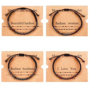 Handmade Morse code beaded bracelet set on kraft card featuring different messages