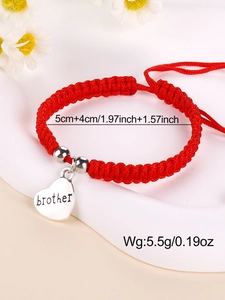 Detail of red handmade braided bracelet with heart-shaped brother charm and silver beads