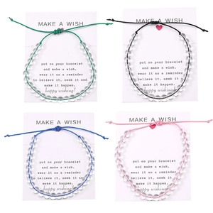 Dettaglio di quattro braccialetti fatti a mano in corda cerata con perle di cristallo 6mm