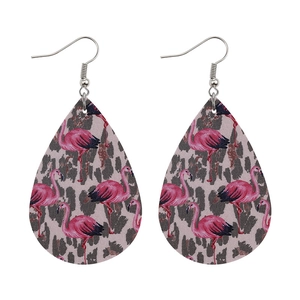 Detail of teardrop earrings featuring pink flamingo and brown leopard faux leather prints
