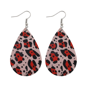 Detail of pink and red leopard print faux leather teardrop earrings with silver hooks