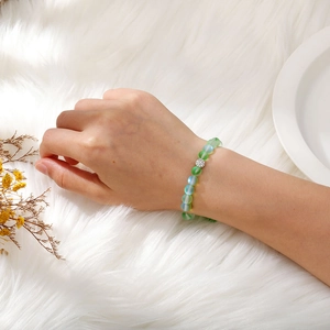 Detailed shot of green frosted beads bracelet with a sparkling rhinestone sphere spacer