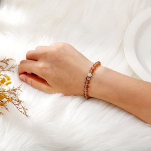 Elastic bracelet with brown moonstones and a sparkling silver pave clay bead