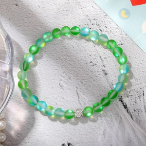 Close-up of frosted gradient beaded bracelet with a sparkling silver pavé bead detail