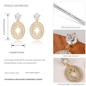 Detalle de pendientes ovalados de plata 925 con estrella de circón y medidas 2,2x1,3 cm