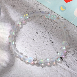 Close-up of frosted iridescent moonstone beaded bracelet with a pavé crystal spacer ball