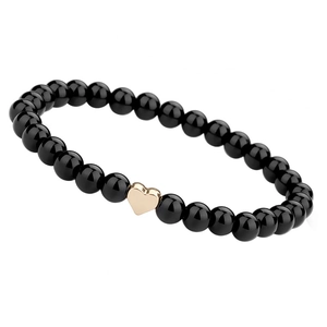 Zwarte 6mm natuursteen kralenarmband met gepolijste roségouden hartbedel