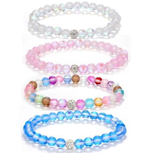 Detail of four frosted moonstone beaded bracelets with micro-pave crystal charms