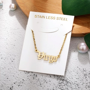 Detailed view of golden Virgo zodiac necklace on stainless steel chain with packaging