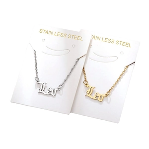 Gothic Leo zodiac necklaces in gold and silver stainless steel on display cards