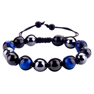 Handmade woven bracelet featuring tiger eye beads and obsidian with adjustable cord