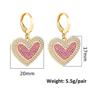 Detail view of gold heart earrings with pink and white pavé cubic zirconia settings