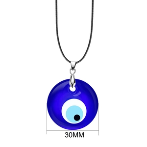 Detailed view of a 30mm blue Evil Eye pendant on a black cord necklace with silver clasp
