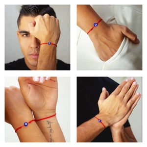 Detail eines roten geflochtenen Evil Eye Armbandes mit verstellbarem Knoten am Handgelenk