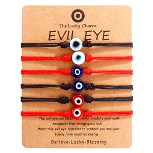 Set of 6 Evil Eye braided cord bracelets in red and black on professional card display