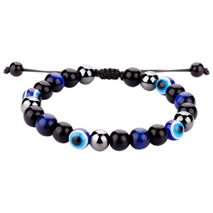 Détail du bracelet réglable œil maléfique avec perles d'obsidienne noire et œil de tigre
