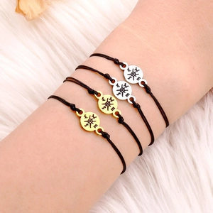 Set of four adjustable woven compass bracelets with gold and silver compass charms