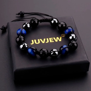 Braided natural stone bracelet with blue tiger eye and obsidian beads on gift box