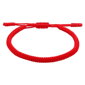 Detail of red handmade braided knot bracelet with adjustable drawstring closure