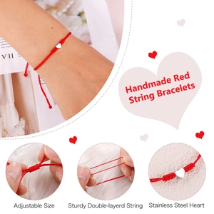 Detail view of adjustable red string bracelet featuring a stainless steel heart pendant