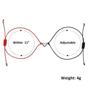 Detail showing adjustable red and black magnetic heart couple bracelets with 11-inch size specs