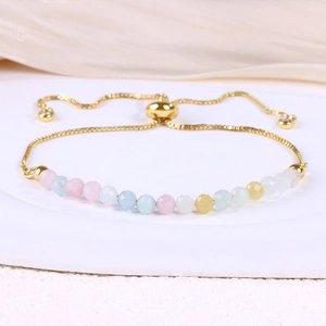 Detail of adjustable gold-plated snake chain bracelet with multi-color crystal beads