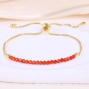 Detail of 3mm red crystal beaded slider bracelet with gold-plated adjustable chain