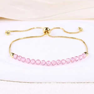 Detail of adjustable 4mm pink crystal beaded bracelet with gold-plated snake chain