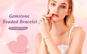 Detailed view of hand-made purple gemstone beaded bracelet on model in soft pink setting