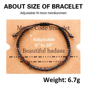 Detail of adjustable Morse Code woven bracelet with wooden beads and gray metal discs
