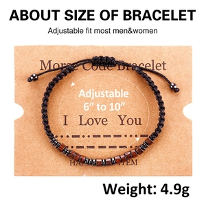 Close-up of adjustable Morse code bracelet with dark wood beads on display card