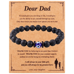 Detail of 8mm lava stone beads and evil eye charm on a sentimental Father's Day gift card