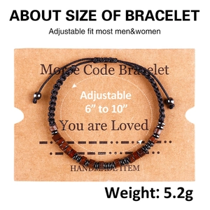 Detail view of handmade Morse code bracelet with wooden beads and adjustable cord