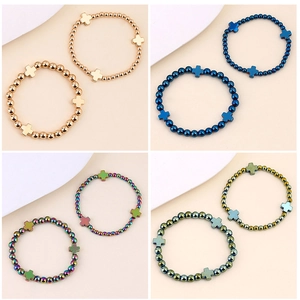 Bracciali elastici con perline e croci in metallo finiture oro, blu, arcobaleno e verde