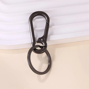 Detail shot of a sleek gunmetal carabiner keychain with a durable flat metal ring