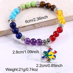 Detailed view of colorful natural stone bead bracelet with a puzzle piece metal pendant
