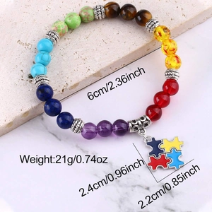 Detail of colorful natural stone bead bracelet with metal puzzle piece charm and size info