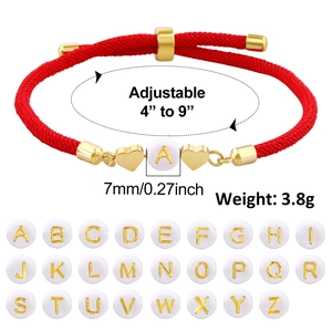 Detail showing adjustable red braided rope bracelet with 7mm letter bead and size dimensions