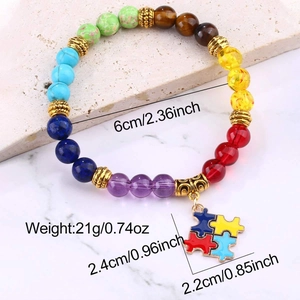 Detail view of 7 chakra stone bracelet with colorful puzzle pendant and size specs