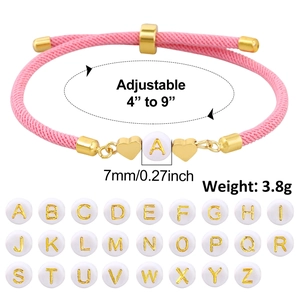 Pink braided rope bracelet with golden heart charms and white letter bead detail