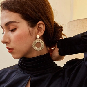 Bohemian large woven rattan hoop earrings with pearl studs for vacation fashion look