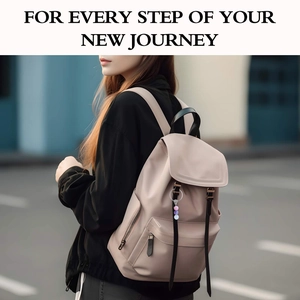 Detail of pink backpack with natural stone beaded keychain on urban street setting