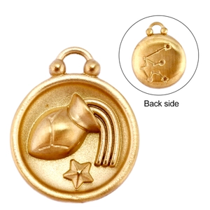 Macro detail of 18k gold Aquarius pendant showing relief design and brushed metal back side